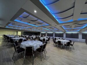 Basic setup of the Conference Centre room at the Polish Hall, with the ceiling lights set to blue. This is located in Edmonton, Alberta, Canada.