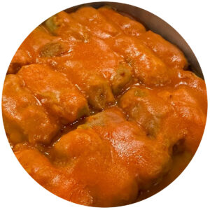 Cabbage Rolls covered in tomato sauce - all made from scratch, are shown here ready to serve