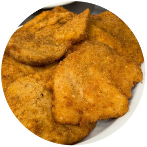 On-site breaded traditional Polish Sznycel, sometimes known by the german spelling Schnitzel.